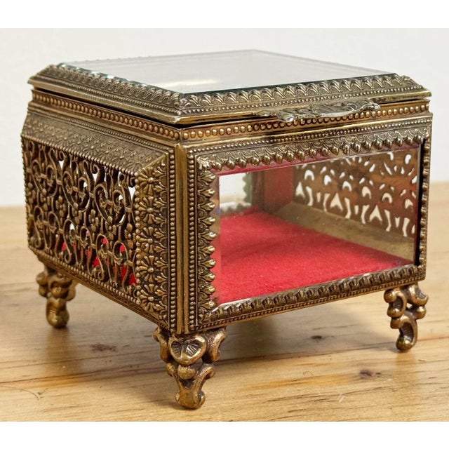 Vintage bass jewelry box perfect for keeping your trinkets and jewelry safe! Lid offers a filigree design handle and...
