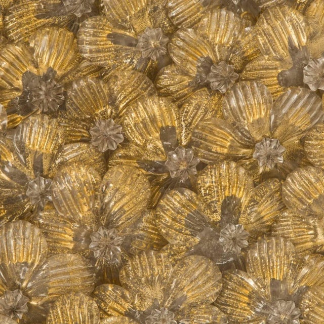 This lovely pair of Barovier wall lights are made of dozens of small roses in precious Murano glass with gold inclusions...