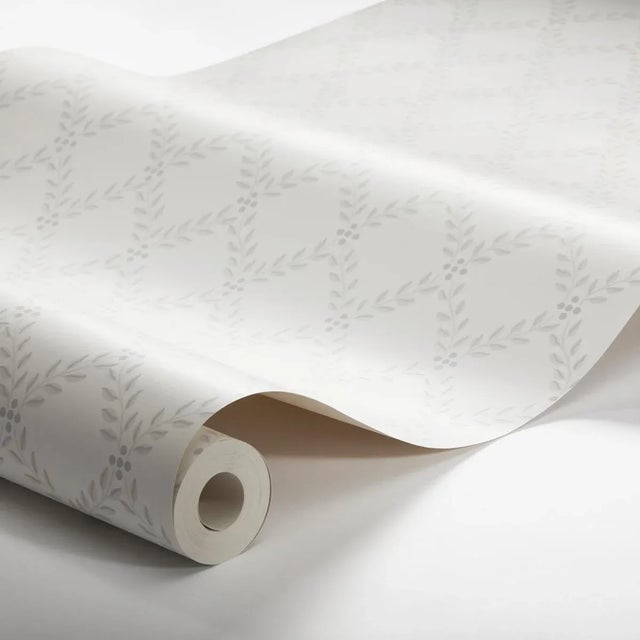 The wallpaper by BorÃ¥stapeter is a classic trellis print of elegantly arranged foliage. Trellis Leaves in grey makes a...