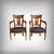 Elegant testaments to early 20th-century craftsmanship, these stained beech armchairs captivate with their harmonious...