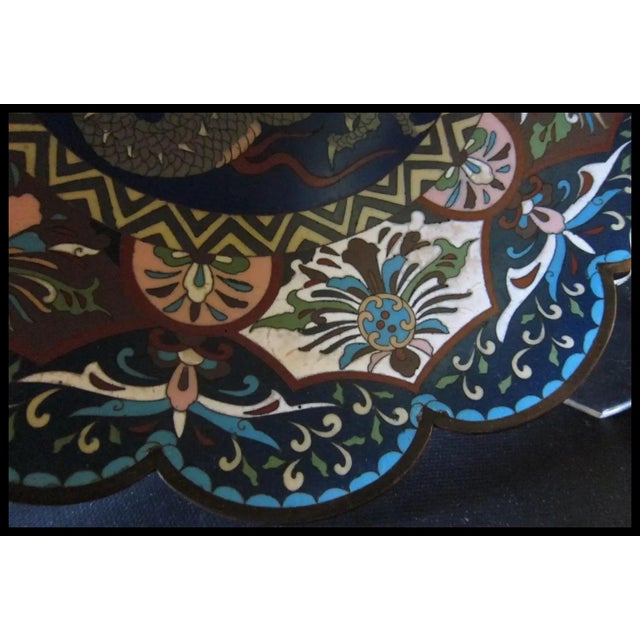 This 19th century cloisonné Chinese charger with scalloped edge, is exceptionally detailed with a splendid depiction of a...