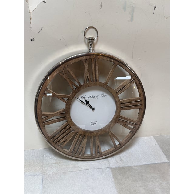 Design Plus Gallery presents a Vintage Inspired Wall Clock by McLaughlin & Scott. The clock has a white face dial with the...