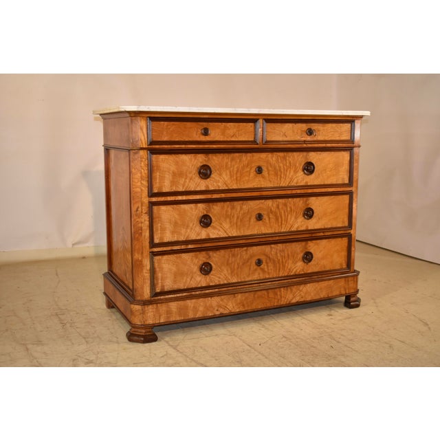 19th century Louis Philippe commode from France. The top is made from Carrara marble, and has a routed edge. The case is...