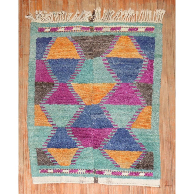 A 3rd quarter of the Century Turkish Tulu shag rug with bright funky colors. 3'7'' x 4'7''