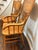 Bring timeless craftsmanship and warm character to your home with this beautiful vintage pair of solid oak pressed-back...