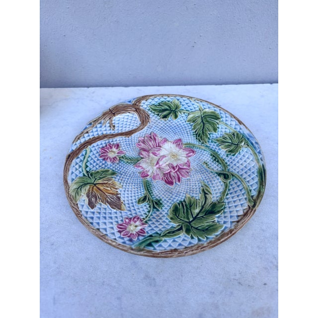 Lovely French Majolica plate pink flowers on a blue basket weave, circa 1890 attributed to Salins.Plate reglued , look...