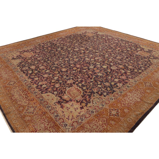 Originating from Ireland circa 1910-1920, this antique Axminster rug is 12’8 x 13’8 and handmade from hand-knotted wool....