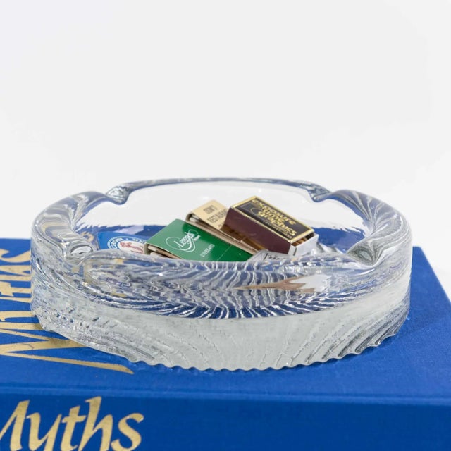 Heavyweight round glass ashtray with embossed shell design in vintage Blenko style. Versatile for using as a catchall tray...