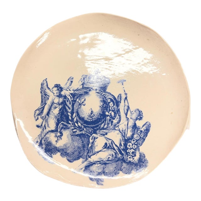 Wonderful art studio pottery in porcelain with blue and pink crests showing angels, a royal crown and garlands. Small...
