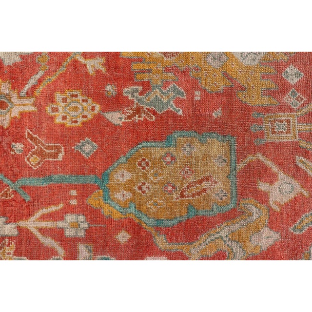 Early 20th Century Antique Turkish Oushak in Tribal Motifs in Soft Coral Blue Marigold and Cream For Sale - Image 4 of 13