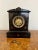 Antique Victorian quality marble clock having a quality black marble clock with a 8 day French movement striking the hour...