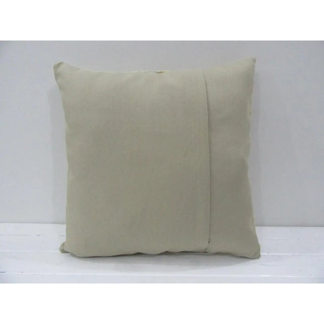 This is a pillow cover made from a vintage kilim rug. The piece was properly washed and ready to use. Pillow inserts not...