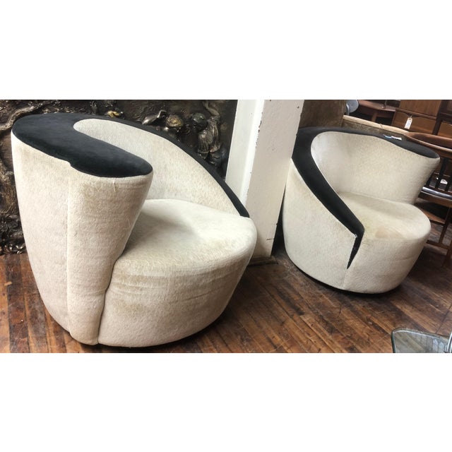 Mid-Century Modern corkscrew lounge chairs with swivel action.