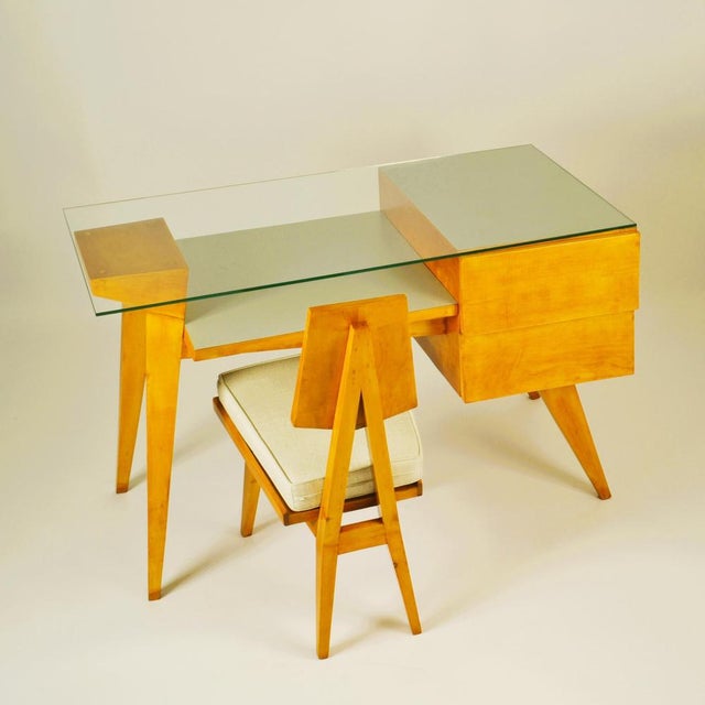 Sculptural Italian School 1950's desk and matching chair is made of cherry wood in the manner of Gio Ponti. The desk has...