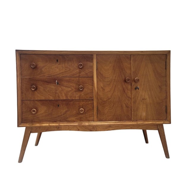 Authentic Nordic-style chest of drawers made of beech burl, circa 1950s. The lightweight wooden frame is veneered with...