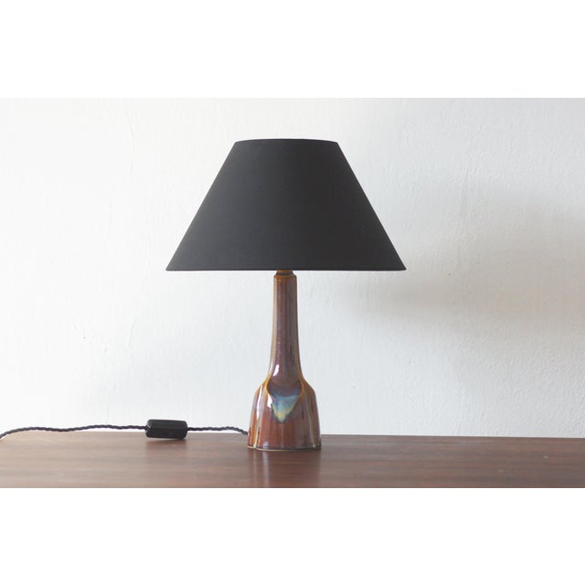 This exceptional glazed ceramic table lamp, attributed to a design by Einar Johansen for the legendary Danish manufacturer...