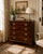 A Chippendale style chest of drawers that can also be used as a nightstand. It has a pull-out tray on top of the first...