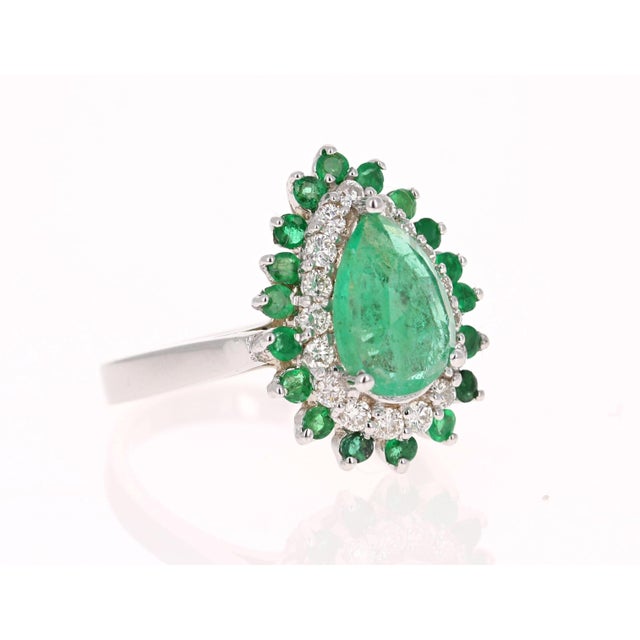 This Pear Cut Emerald ring has a 1.46 Carat Natural Emerald that measures at 7 mm x 9 mm. It is further embellished with...