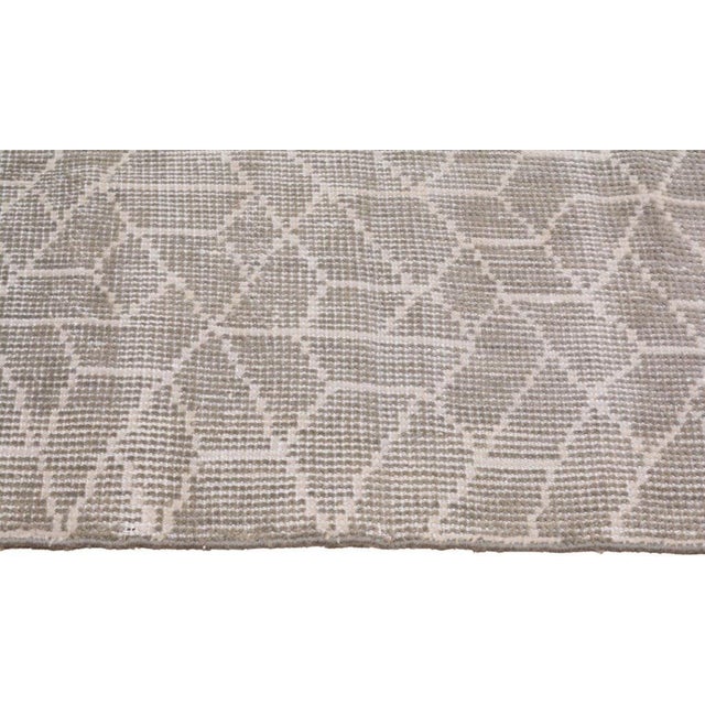 Hand-knotted with care using traditional rug-making techniques, this wool rug blends timeless craftsmanship with a modern...