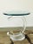 A custom made lucite and glass side table. The base and top are connected by a curved cylinder of lucite creating a fluid...