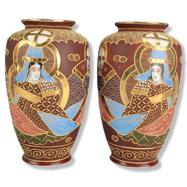 Of baluster form, each finely executed in polychrome enamels with raised moriage slip and lavish gilding, the surfaces...