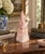 A beautifully proportioned marble obelisk in richly veined shades of pink and cream. The sculptural silhouette and...