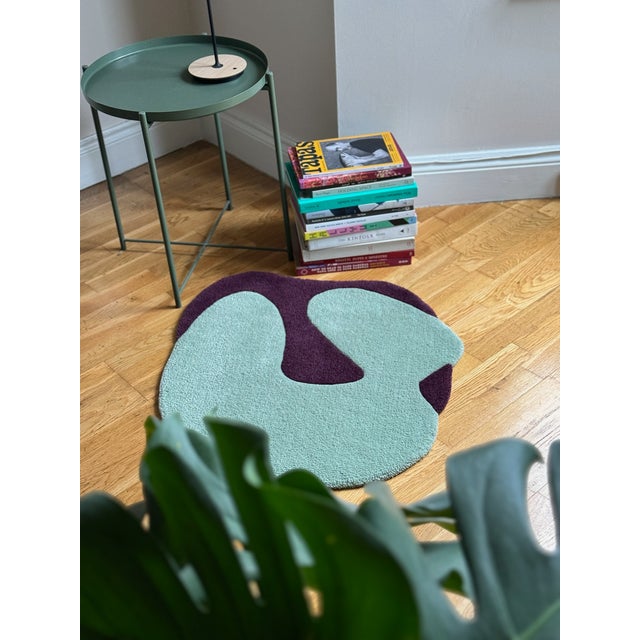 Abstract shaped wool rug by London-based artist Alan Thomas. This piece is made from 100% New Zealand wool in sage and...