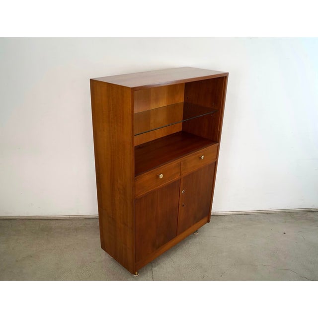Vintage 1960's Mid century Modern hutch / cabinet for sale. It's a great size, and very versatile. It has a glass shelf...
