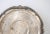This large vintage Victorian style silver plate on copper lazy susan tray on a pedestal features an elegant design with...