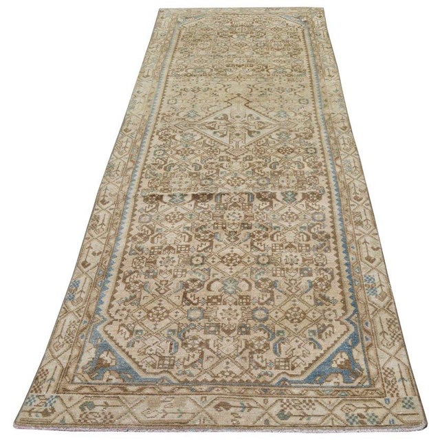 Hand-knotted with care using traditional rug-making techniques, this wool rug blends timeless craftsmanship with a modern...