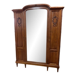 Antique Carved Oak Triple-Door Armoire With Beveled Mirror, Early 20th Century For Sale