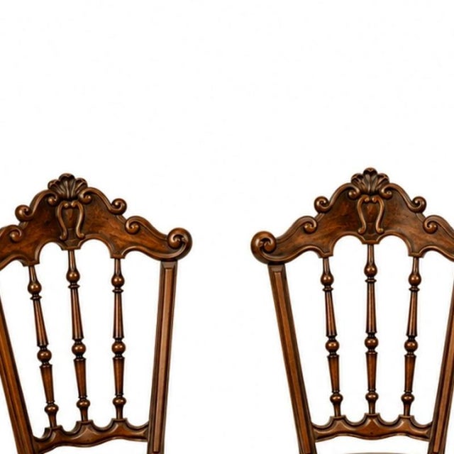 Furniture - Four romantic chairs; made of fine wood. Portuguese, 20th century; carved fine wood; open backs with straw...
