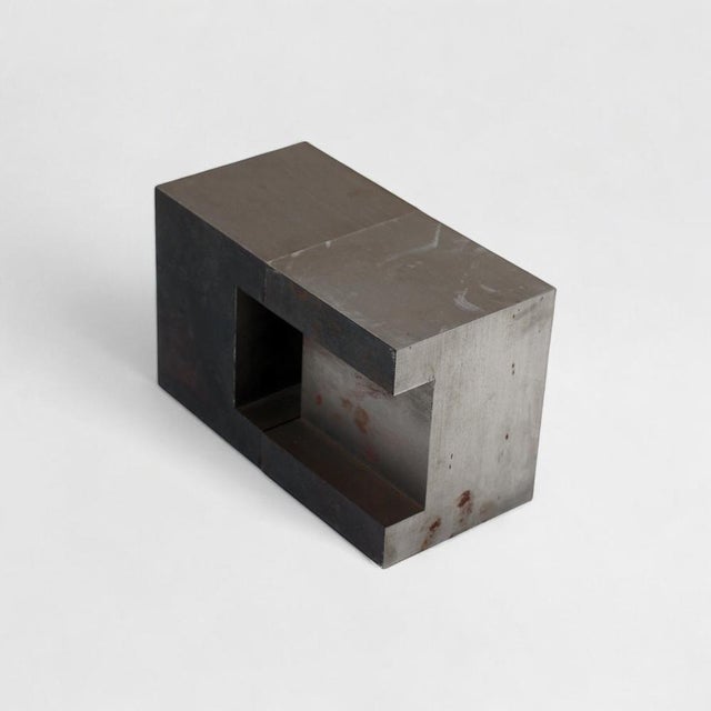 This striking two-part steel sculpture by Dutch artist Cor van Dijk (born 1952 in Pernis) exemplifies minimalist...