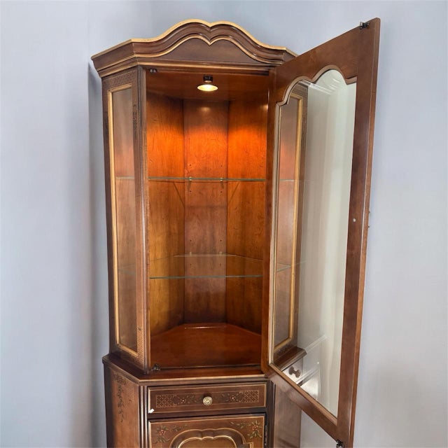 Bring timeless elegance into any room with this beautifully crafted vintage Chinoiserie corner curio cabinet, dating from...