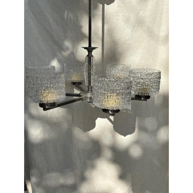 Classic 6-arm chandelier, Sweden, 1960s. The textured glass shades beautifully diffuse the light. The central bar features...