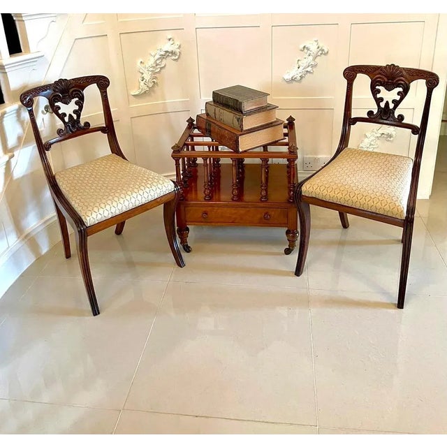 Quality antique Victorian figured walnut canterbury having the impressive original turned finales above three sections...