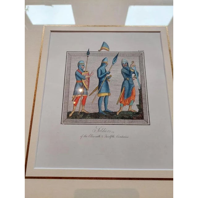 Antique print titled 'Soldiers of the Eleventh & Twelfth Centuries'. Original antique print of Soldiers of the 11th and...