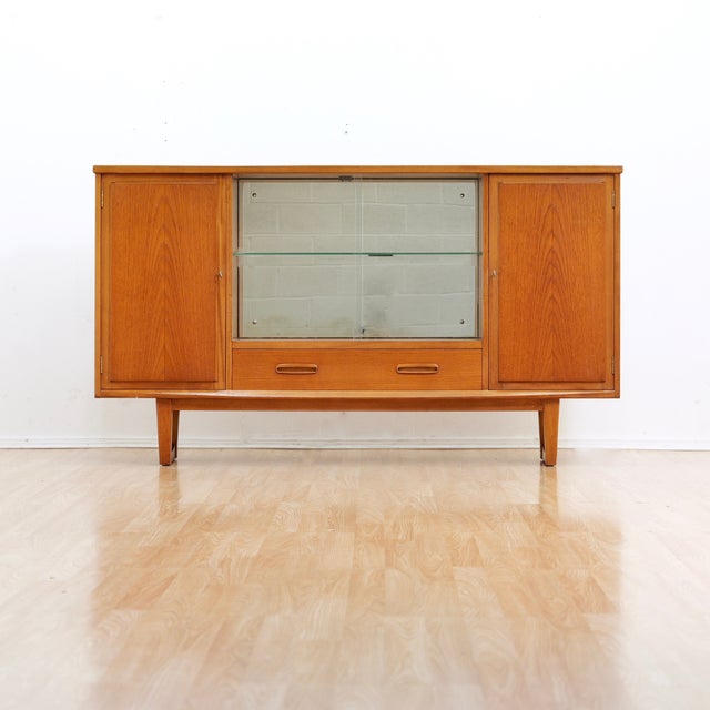 Mid Century cabinet by Jentique Furniture. This vintage china cabinet is a wonderful design and excellent storage piece....