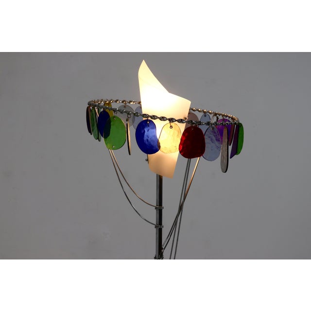 Italian table lamp model Sibari by Toni Cordero for Artemide from the 1990s. The lamp has a bronze base with a chromed...