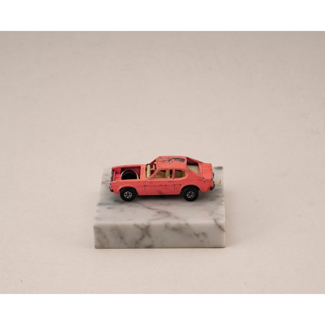 Original vintage die cast model of the Ford Capri from Matchbox, Series No. 54, mounted on a solid marble base. A unique,...