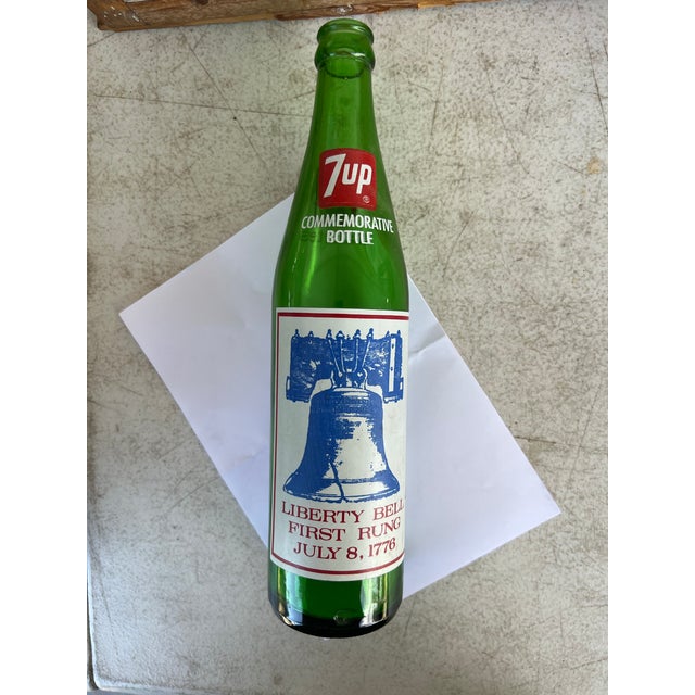 This is a vintage 1976 7Up commemorative green glass soda bottle celebrating the United States Bicentennial.Commemorative...