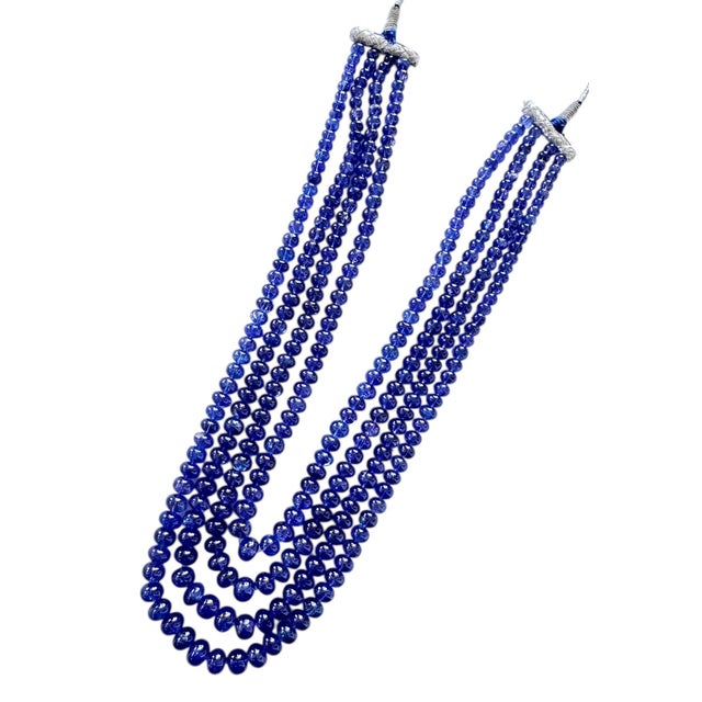 Tanzanite Blue Bead Rondelle Multistrand Cord Necklace This stunning 1,600 carat four strand necklace is composed of...