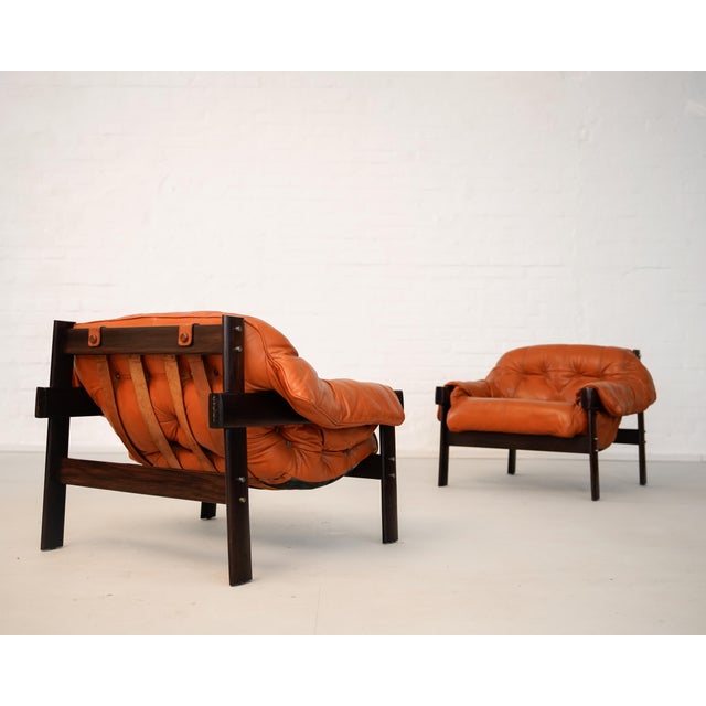 The mp-41 armchair by percival lafer demonstrates a precise balance of craftsmanship and structural innovation. Its solid...