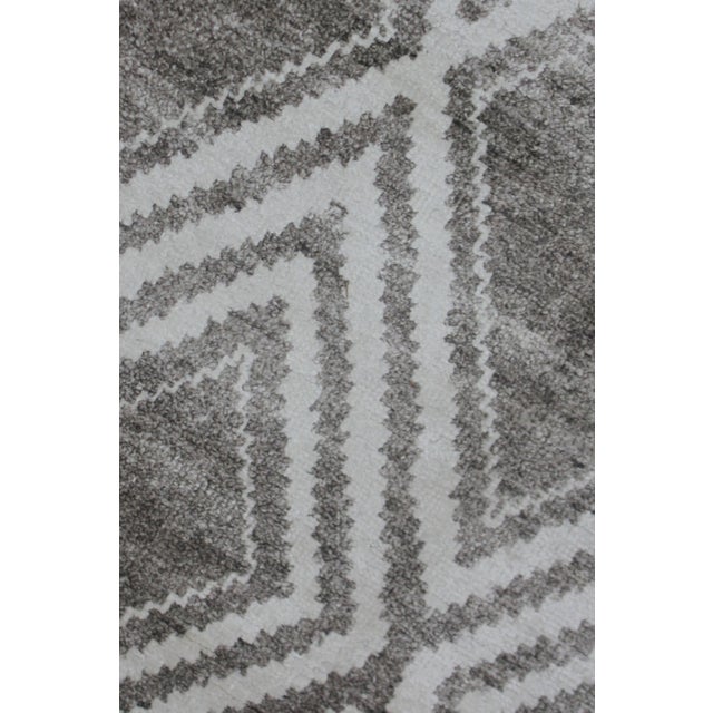 A beautiful handmade environmentally friendly Bamboo and silk rug, with a geometric design, made of 75% bamboo silk and...