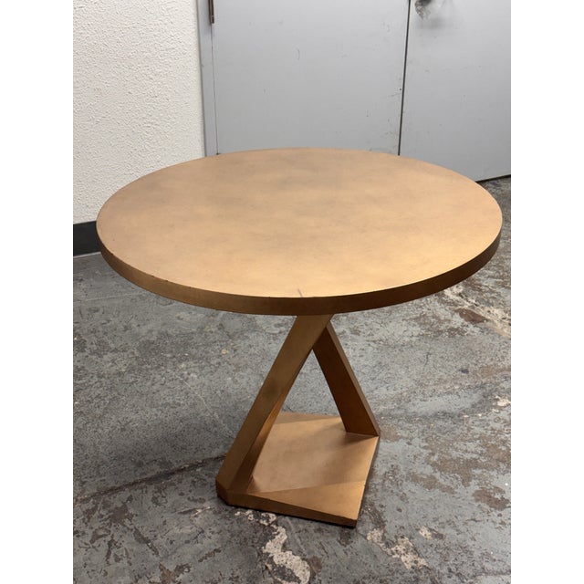 Design Plus Gallery presents a Gold Metallic Occasional/Foyer Table of Custom Design. The table is entirely finished in a...