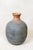 Unearth the past with this antique Asian rice wine clay container, a testament to the craftsmanship of a bygone era. Its...