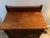 Early20 century solid oak piece, with 2 drawers and lower cabinet. There is a backsplash, so was orinally used as a...