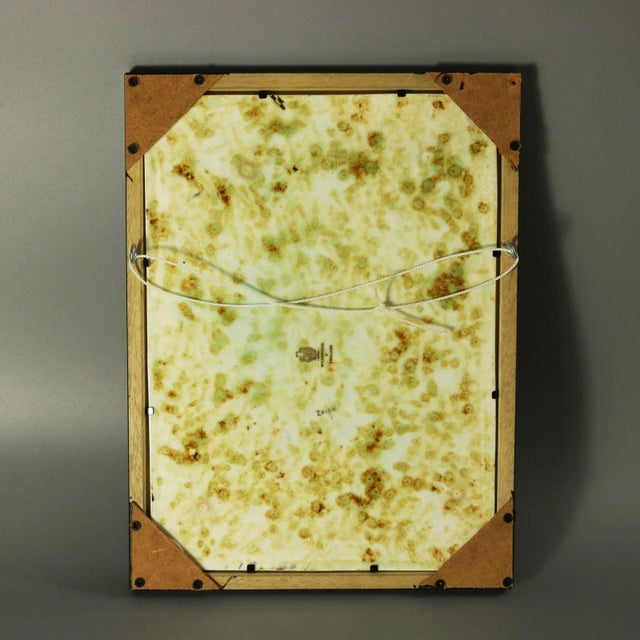 Wedgwood Fairyland lustre plaque decorated in the 'Elves in a Pine Tree' design - a woodland scene with center elf smoking...