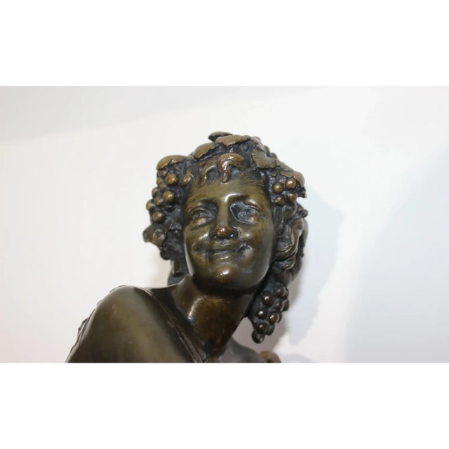 This stylish and chic grand tour bacchus bronze sculpture on gilt and rouge Royale marble base was acquired from a Palm...