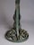 Art Deco table lamp from the 1920s-1930s. The wrought iron base has a green patina highlighted with gold. It is formed by...